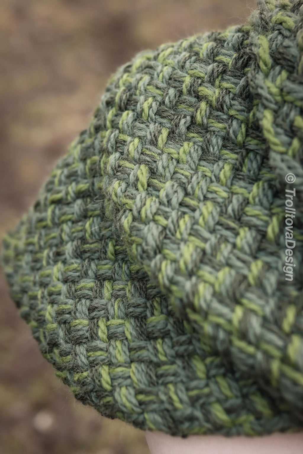 Handwoven twisted capelet in forest green wool and alpaca.