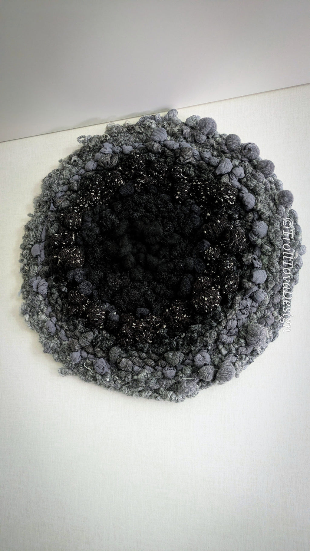 One of a kind handmade textile wall art in gray and black.