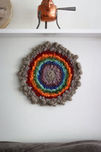 One of a kind handmade textile wall art in gray and rainbow.