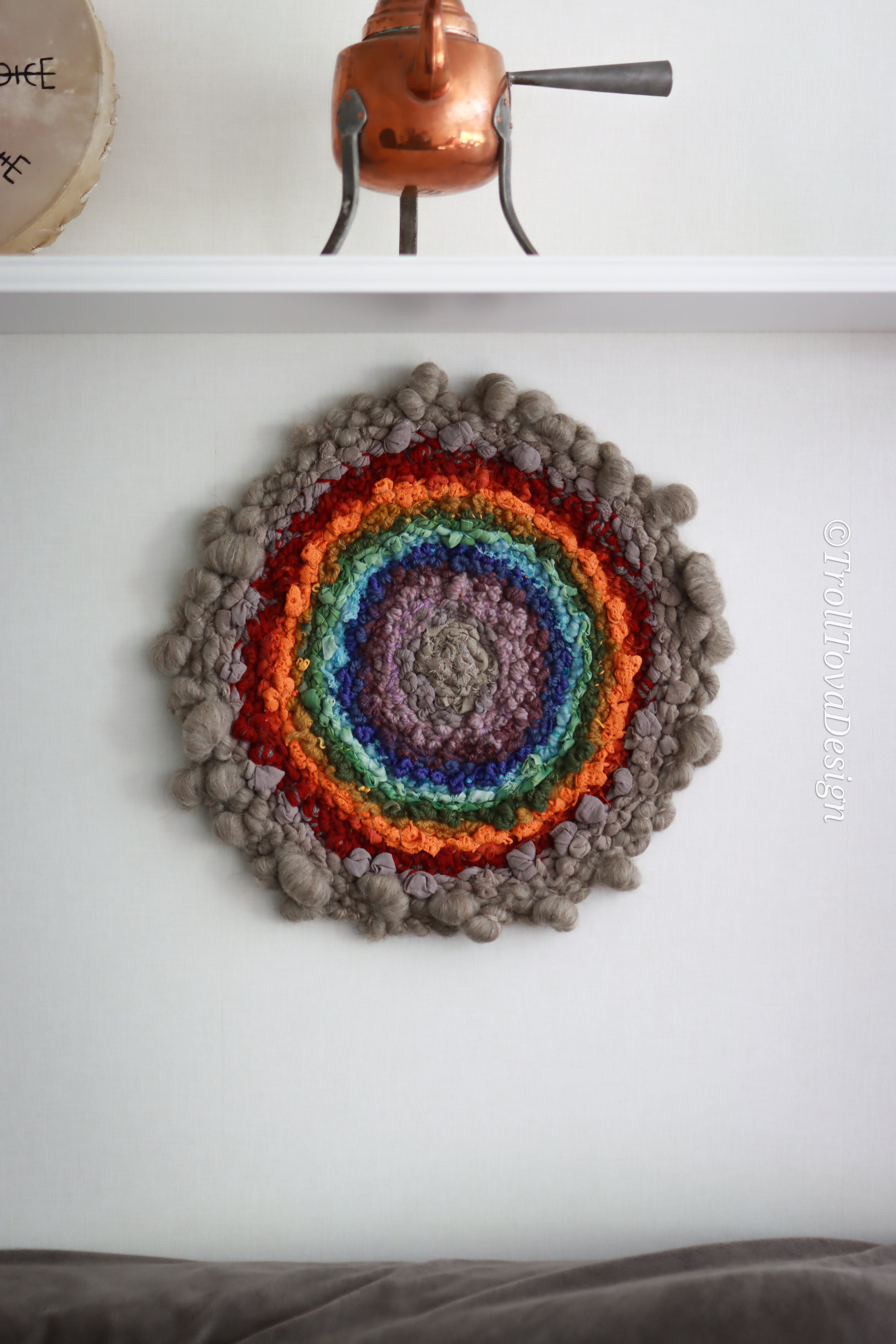 One of a kind handmade textile wall art in gray and rainbow.