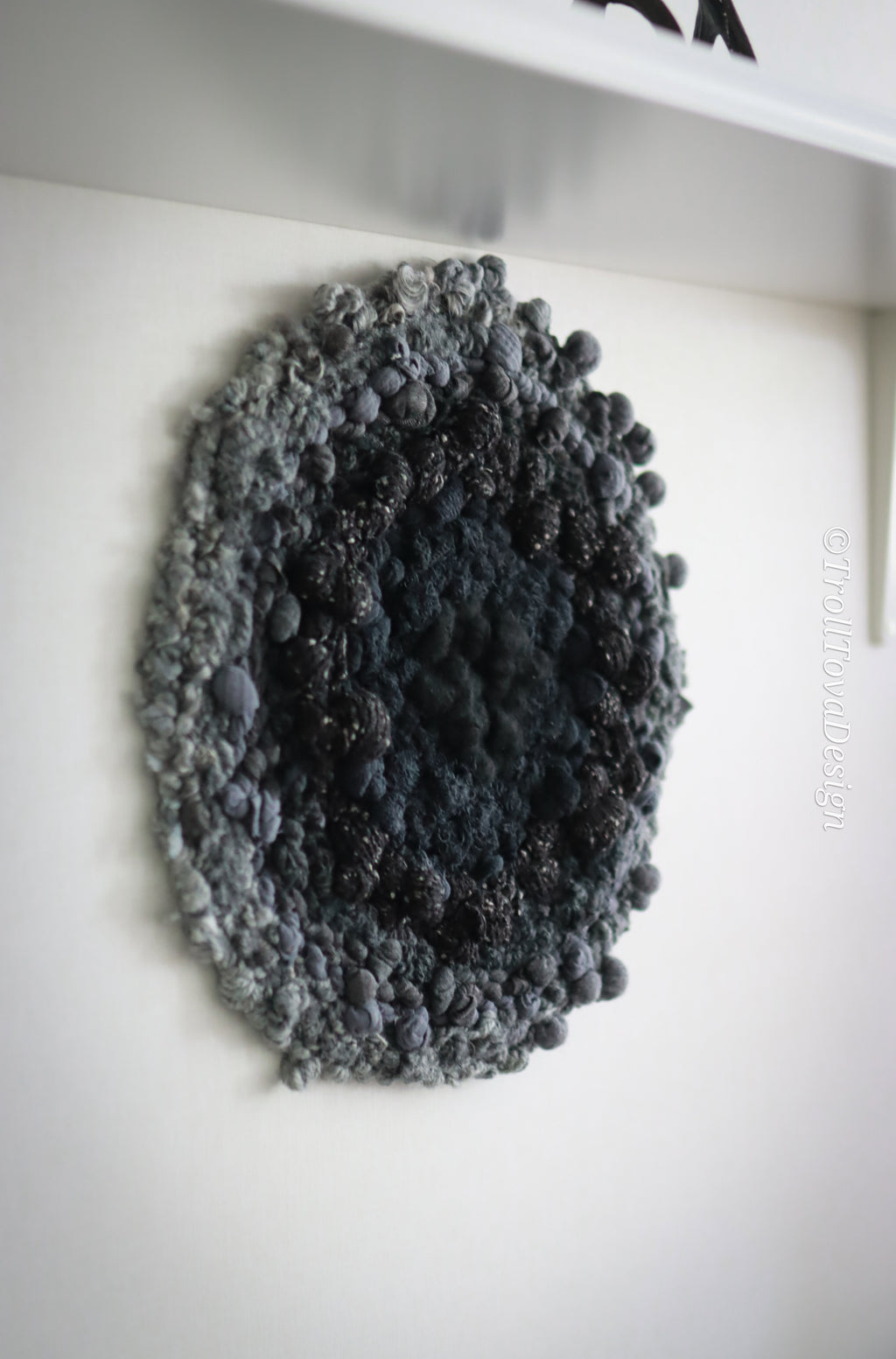 One of a kind handmade textile wall art in gray and black.