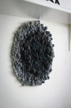 One of a kind handmade textile wall art in gray and black.