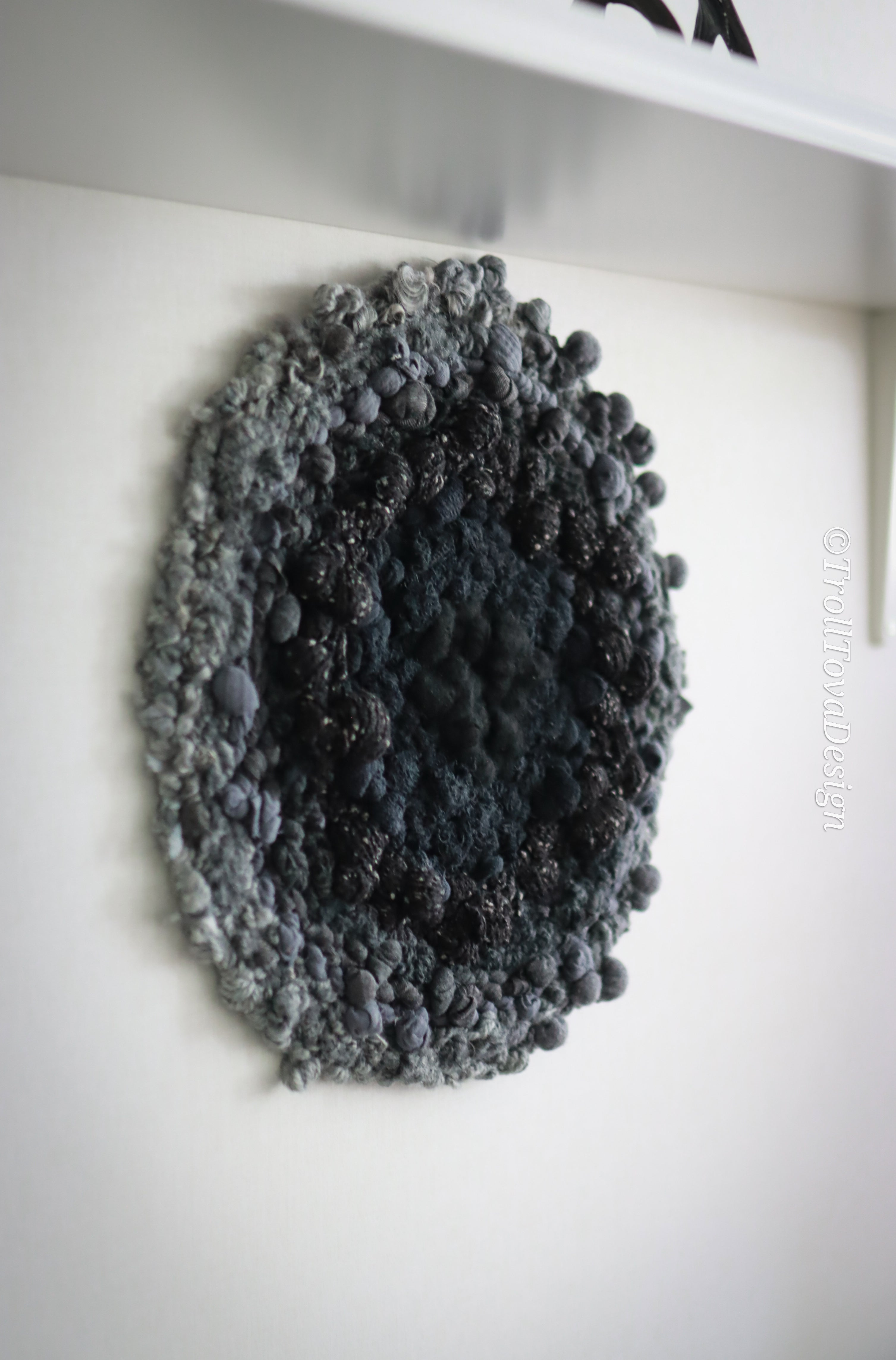 One of a kind handmade textile wall art in gray and black.