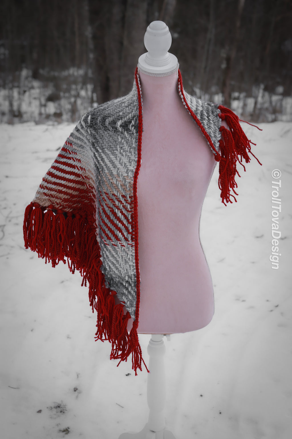 Handwoven triangle shawl made from yarn scraps.