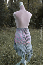 Handwoven triangle shawl made from yarn scraps.