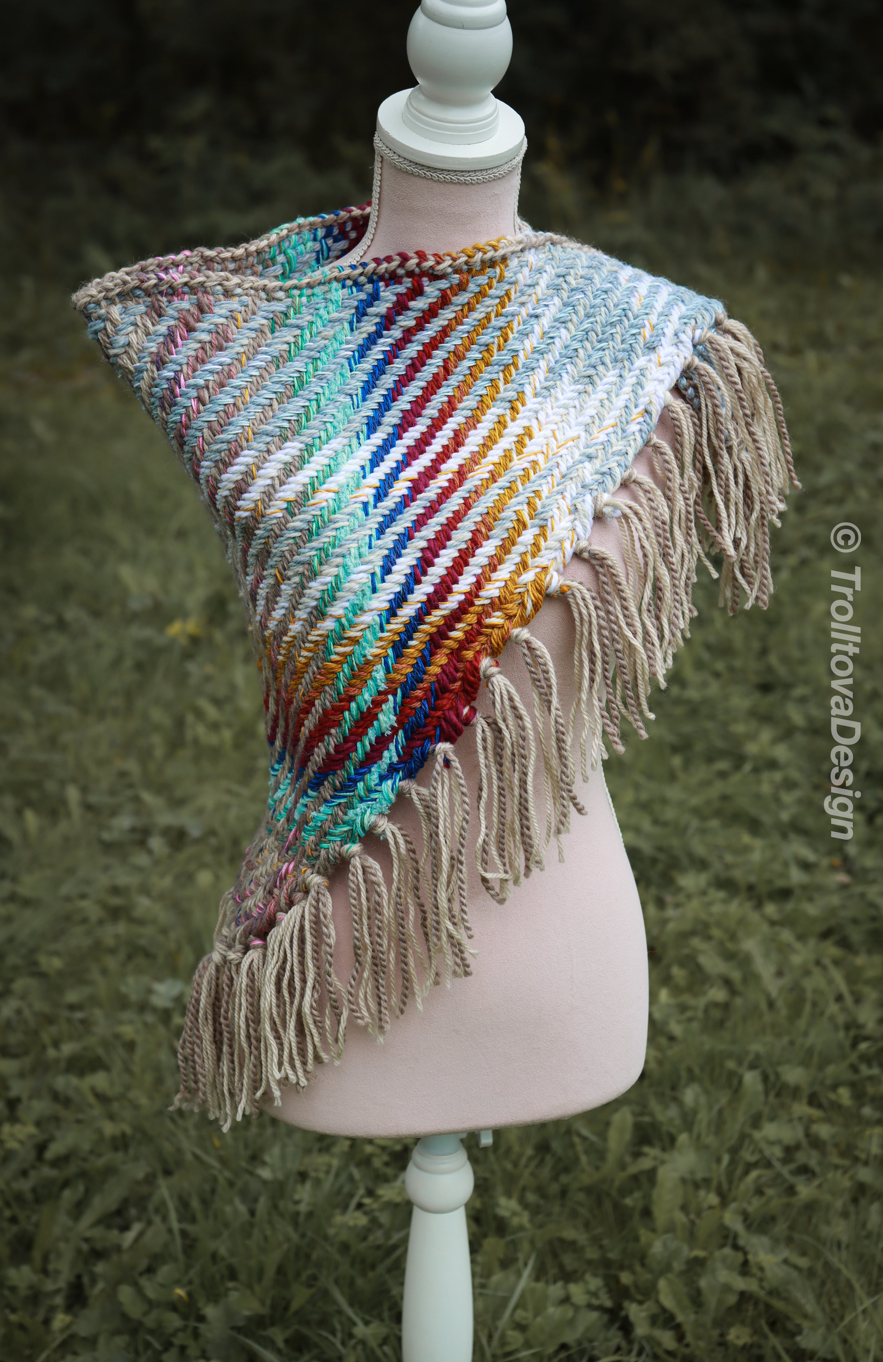 Handwoven triangle shawl made from yarn scraps.