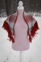 Handwoven triangle shawl made from yarn scraps.