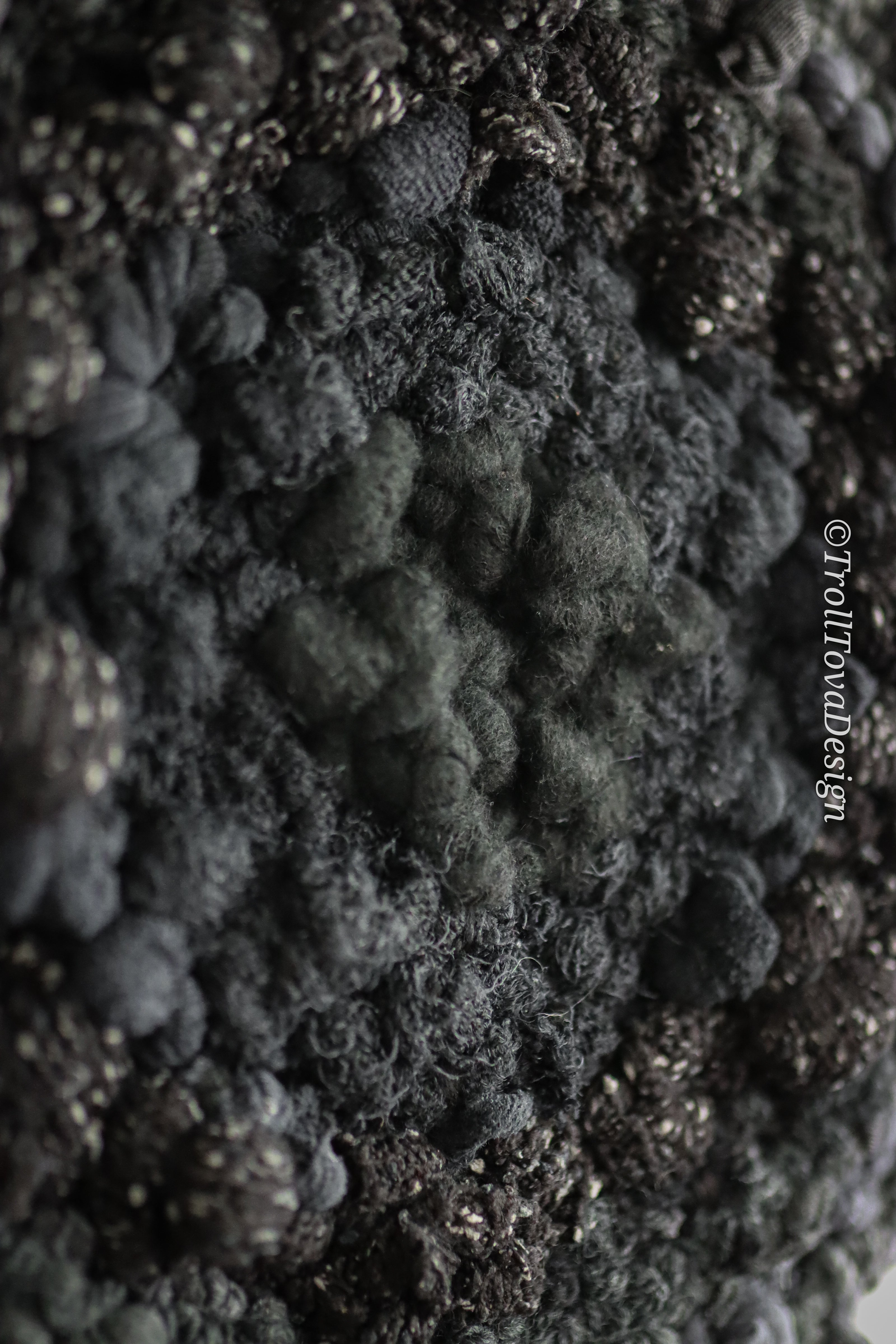 One of a kind handmade textile wall art in gray and black.