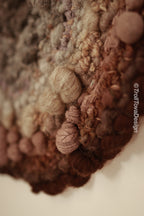 One of a kind handmade textile wall art in gray and brown.