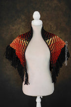 Handwoven triangle shawl made from yarn scraps.