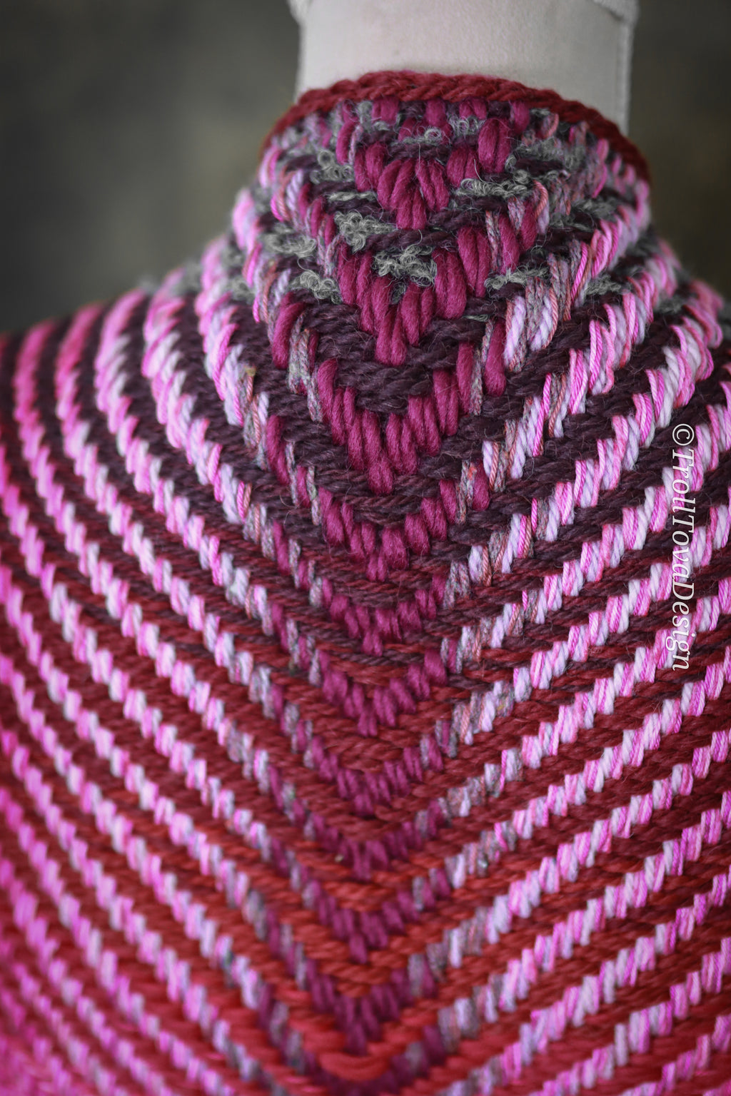 Handwoven triangle shawl made from yarn scraps.
