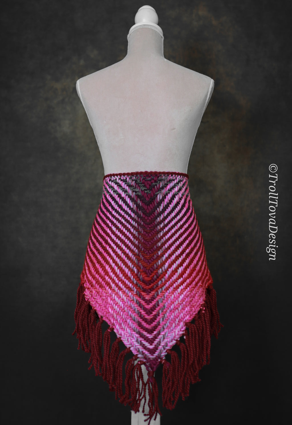 Handwoven triangle shawl made from yarn scraps.