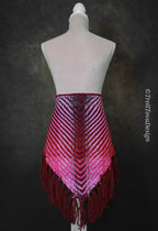 Handwoven triangle shawl made from yarn scraps.