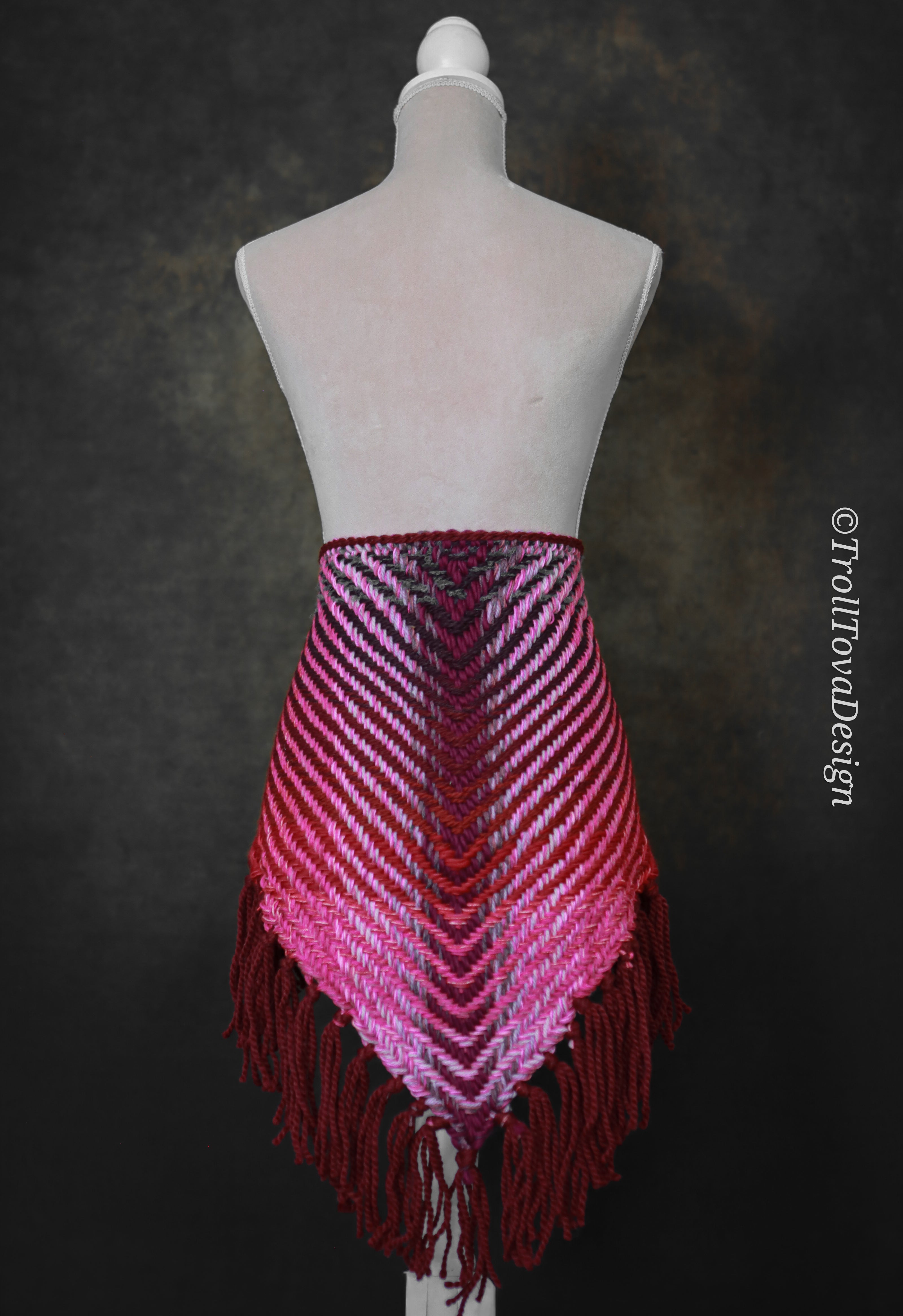 Handwoven triangle shawl made from yarn scraps.