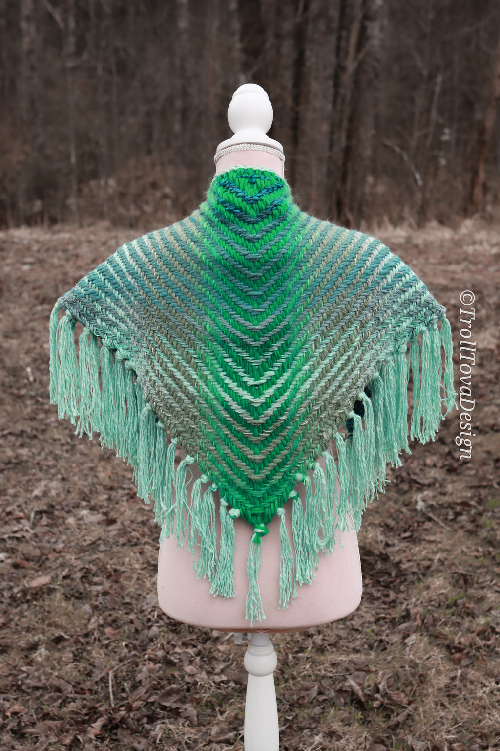 Handwoven triangle shawl made from yarn scraps.