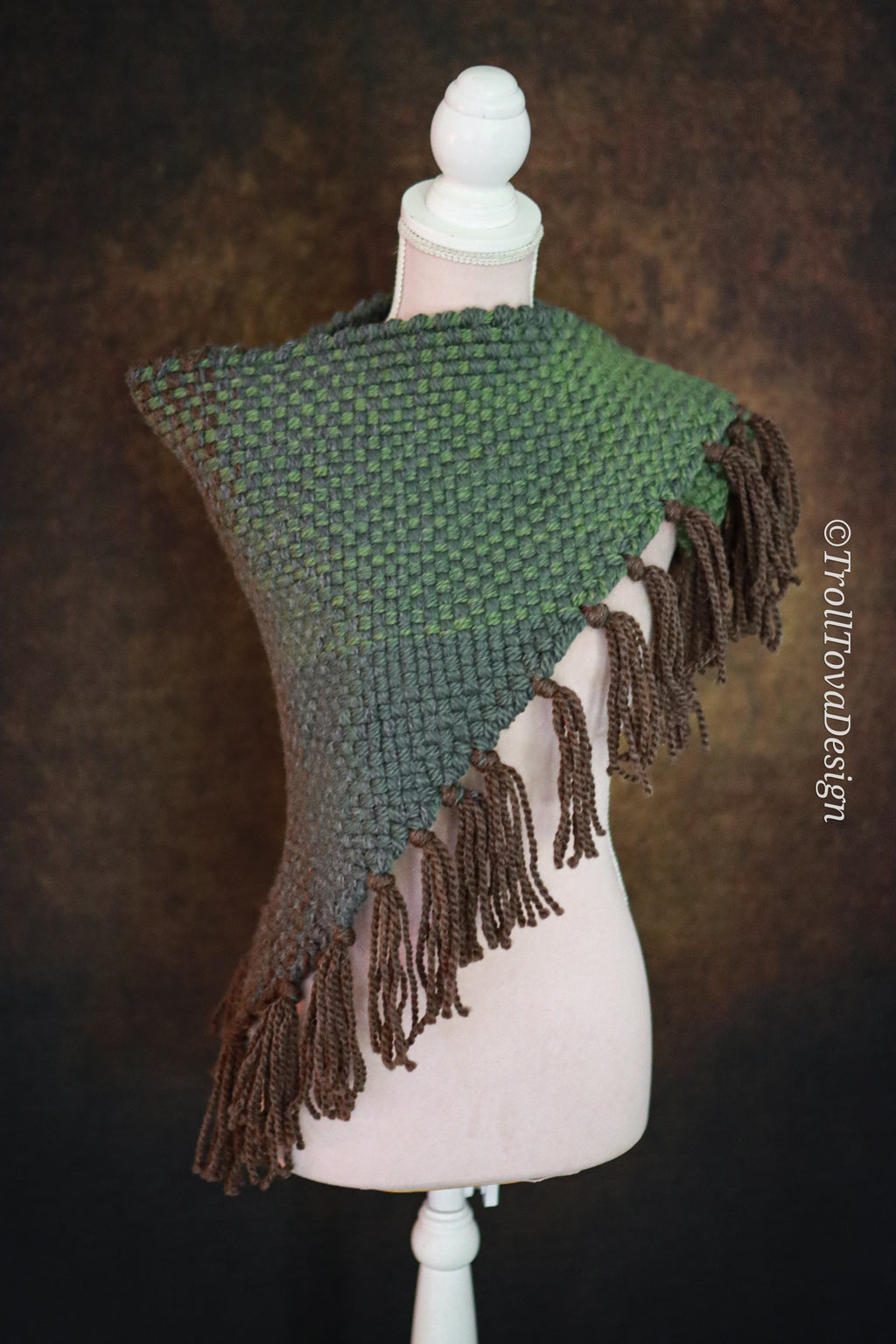 Handwoven triangle shawl made from yarn scraps.
