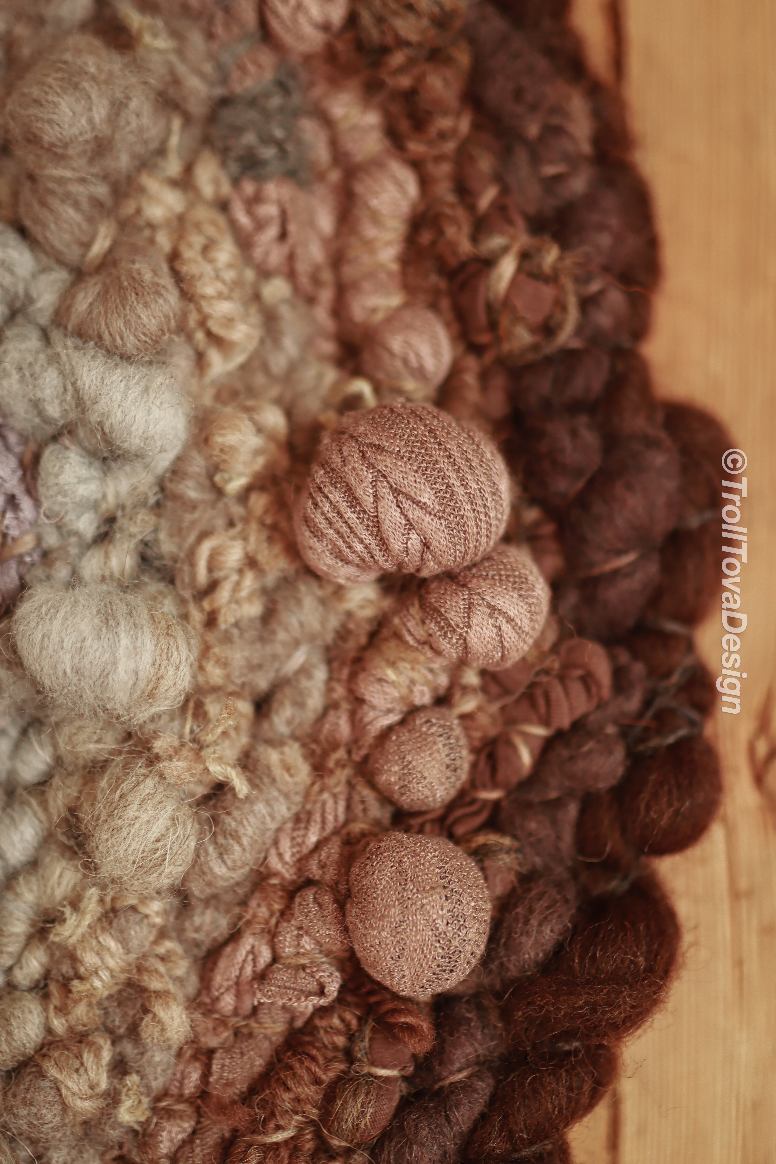One of a kind handmade textile wall art in gray and brown.