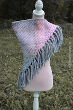 Handwoven triangle shawl made from yarn scraps.