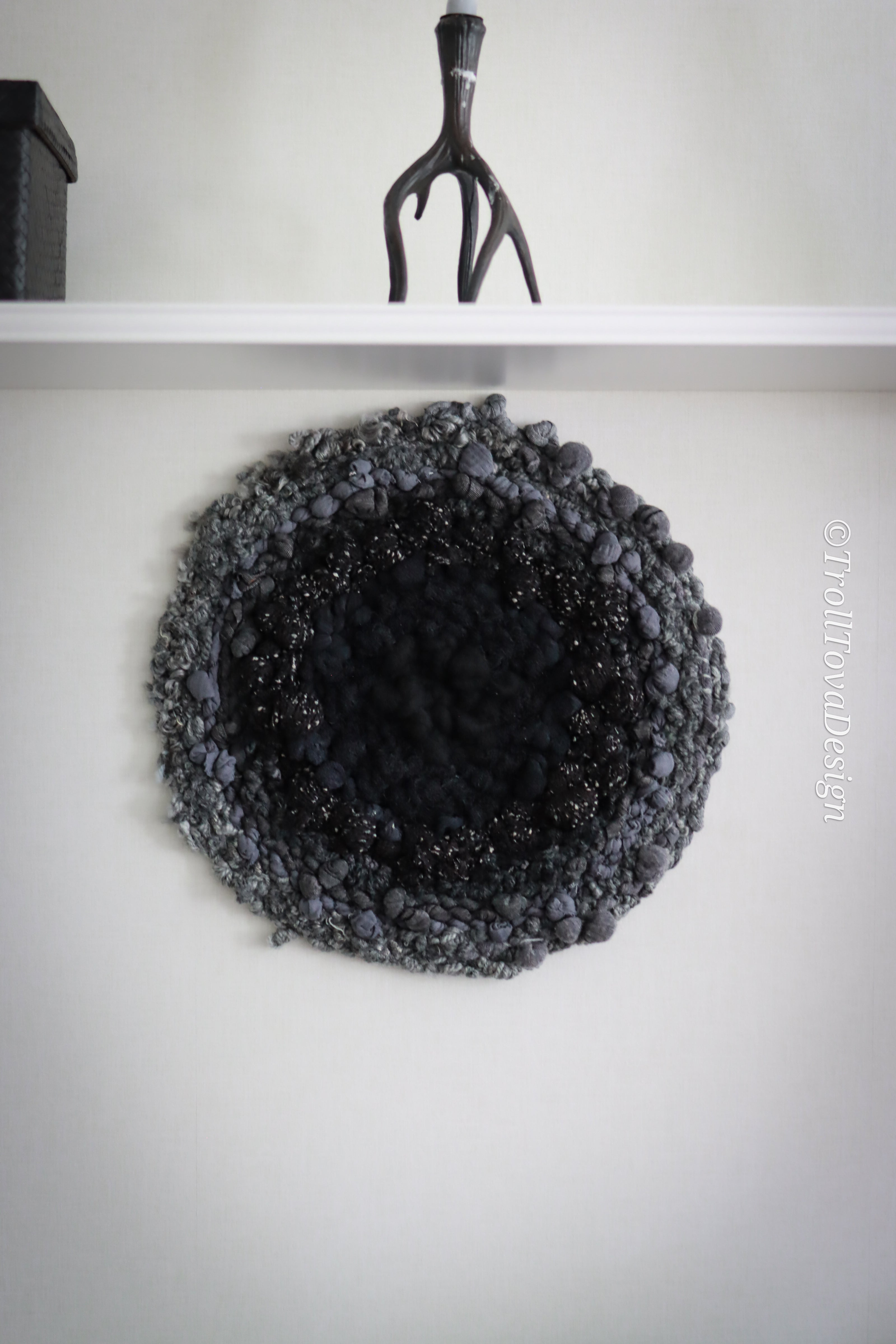 One of a kind handmade textile wall art in gray and black.