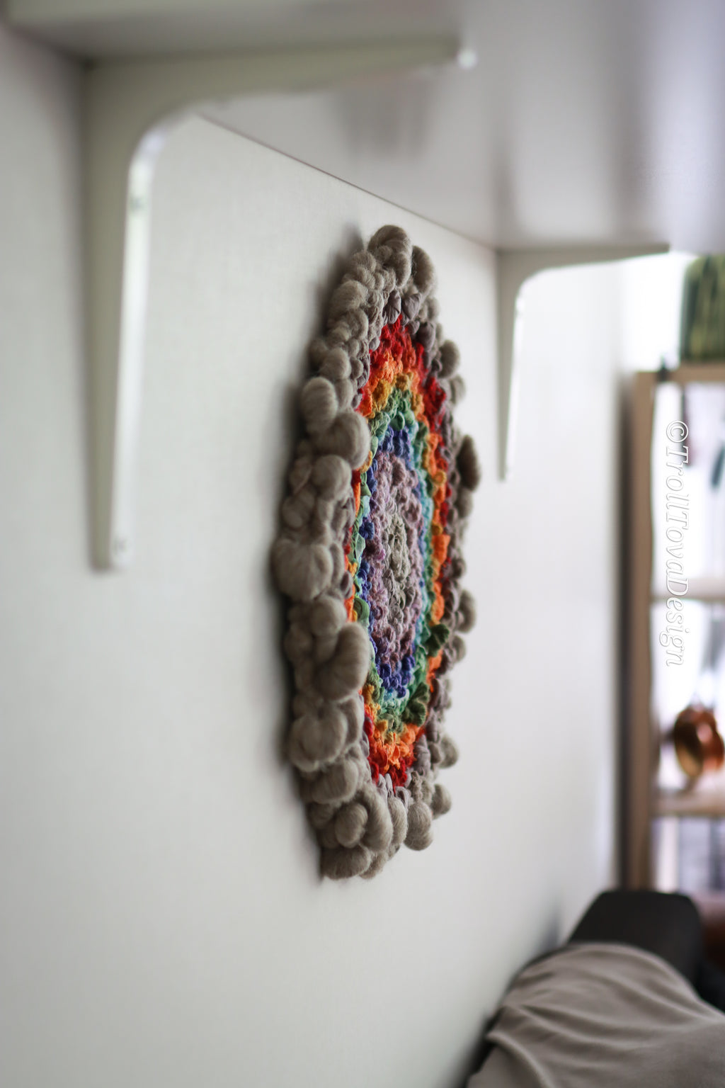 One of a kind handmade textile wall art in gray and rainbow.