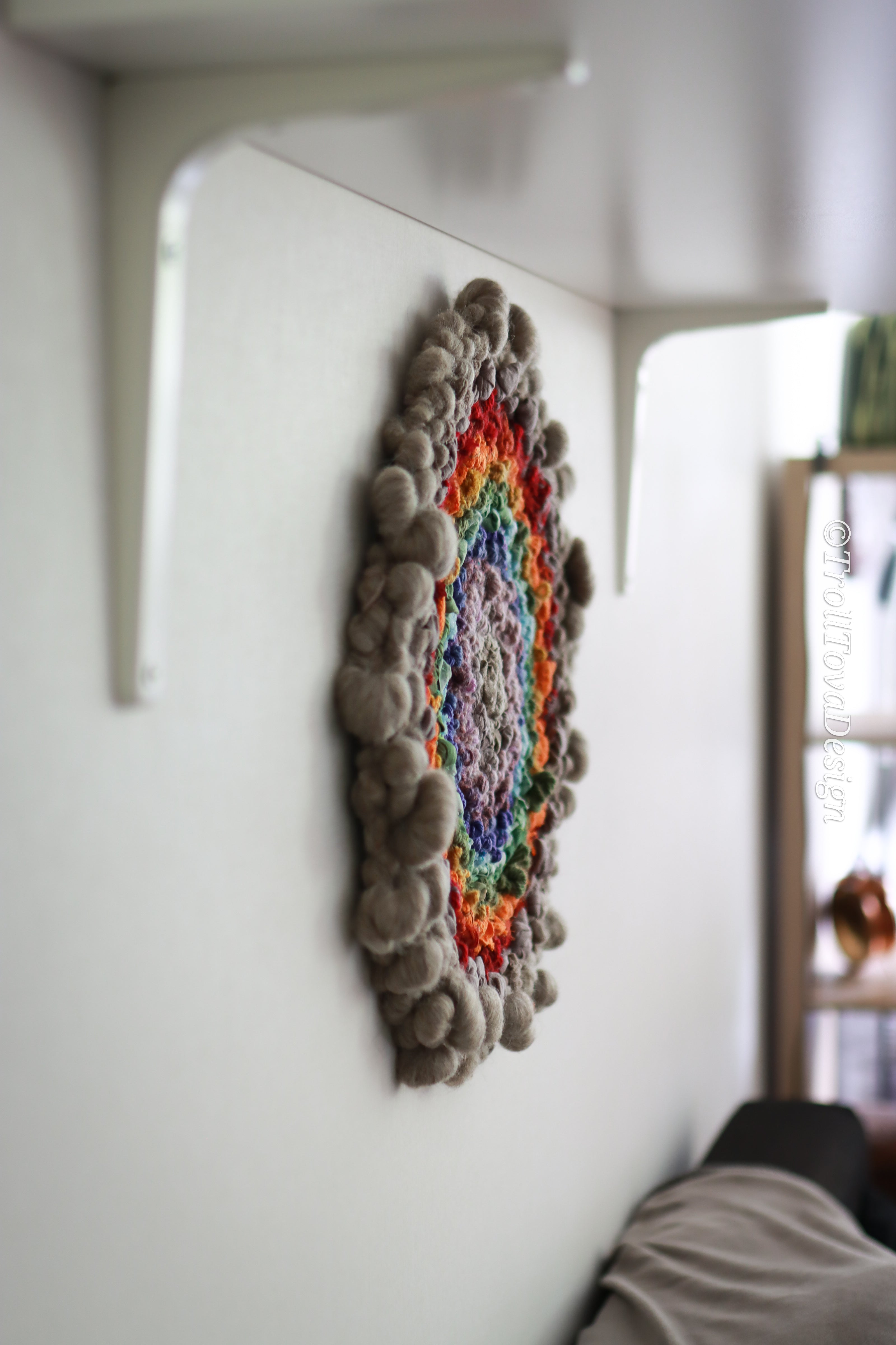 One of a kind handmade textile wall art in gray and rainbow.