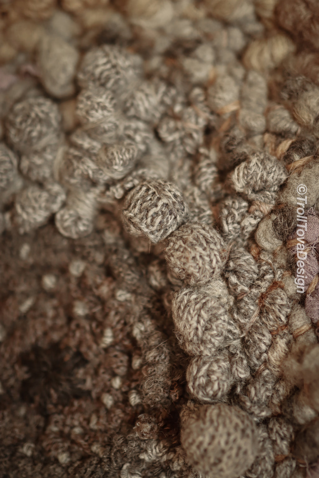 One of a kind handmade textile wall art in gray and brown.