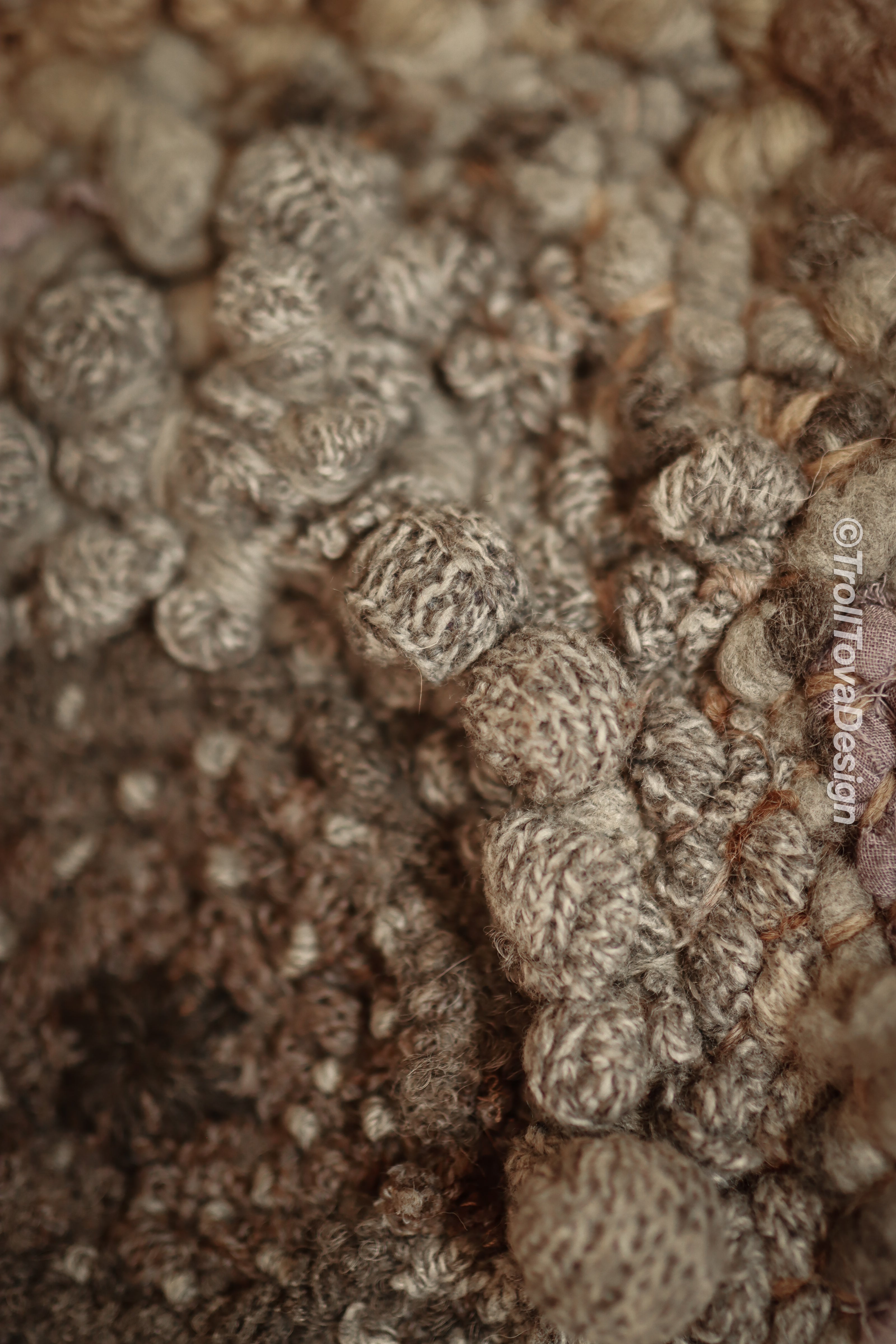 One of a kind handmade textile wall art in gray and brown.