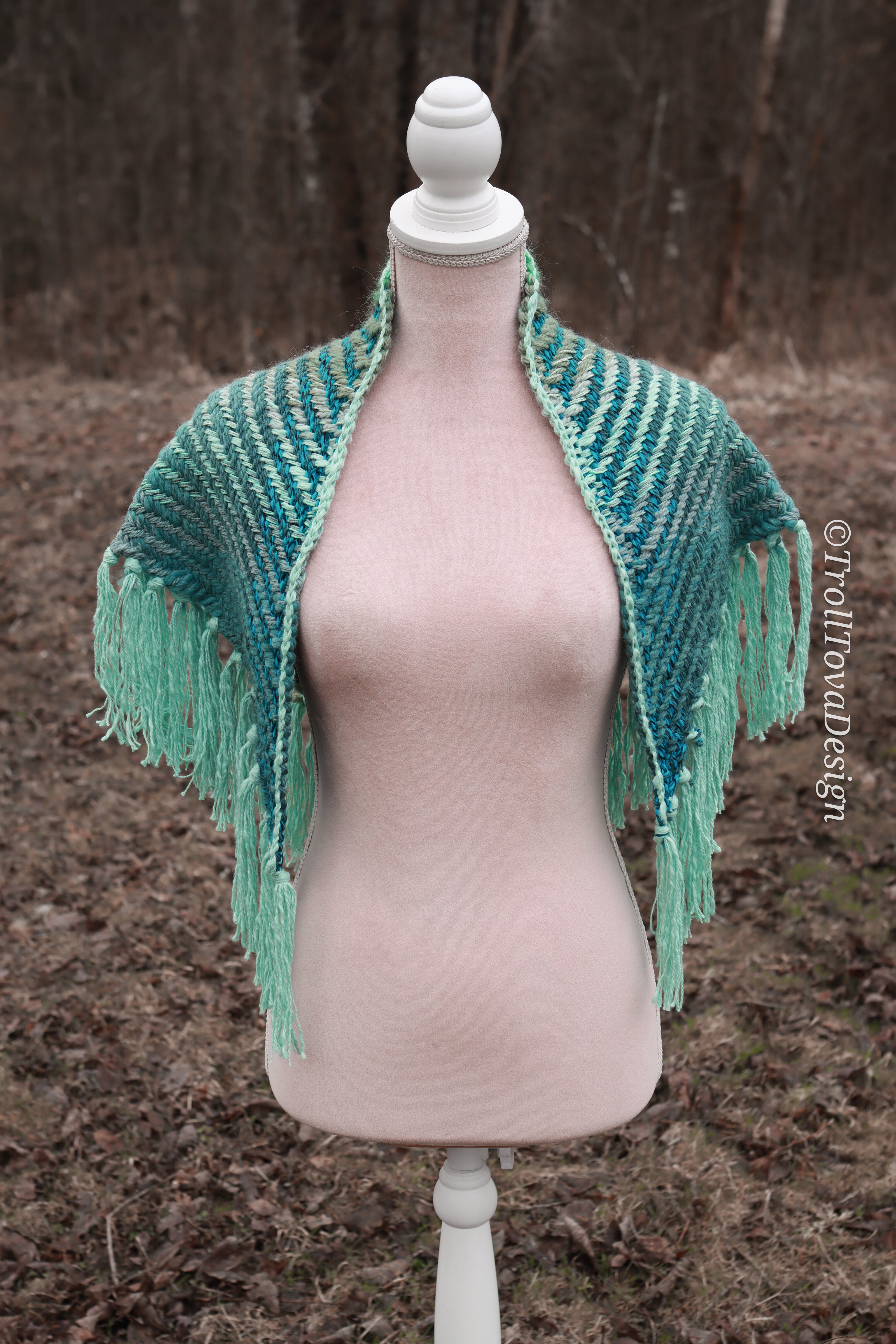 Handwoven triangle shawl made from yarn scraps.