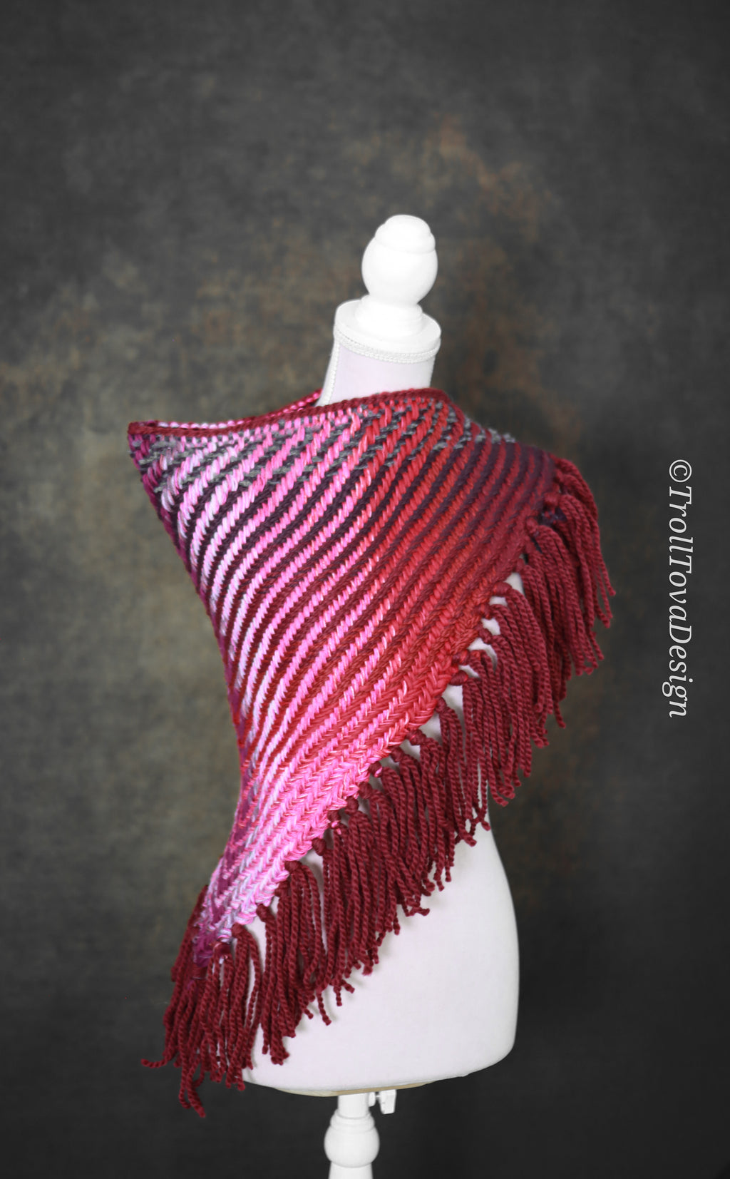 Handwoven triangle shawl made from yarn scraps.