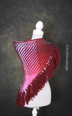 Handwoven triangle shawl made from yarn scraps.