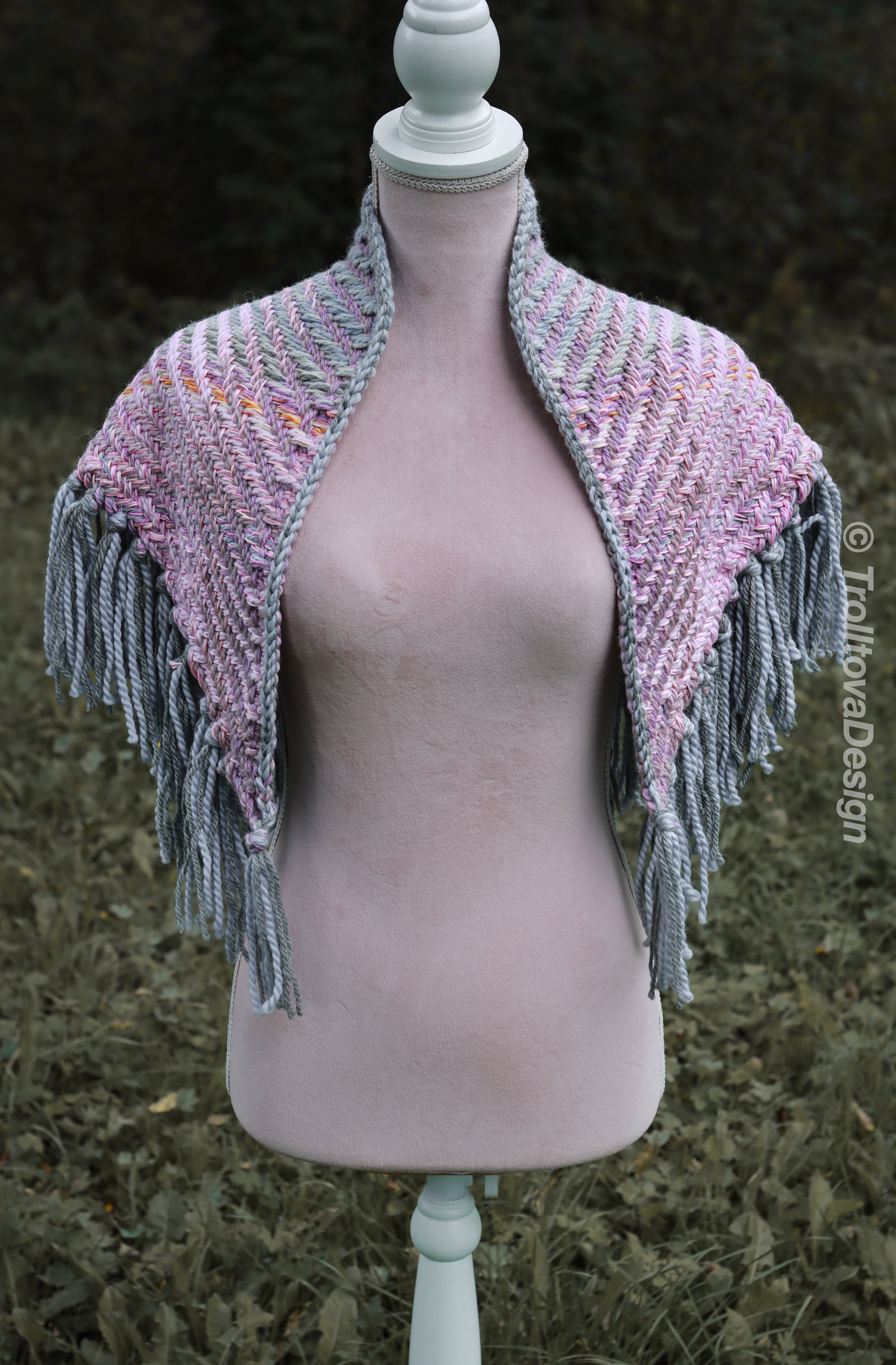 Handwoven triangle shawl made from yarn scraps.
