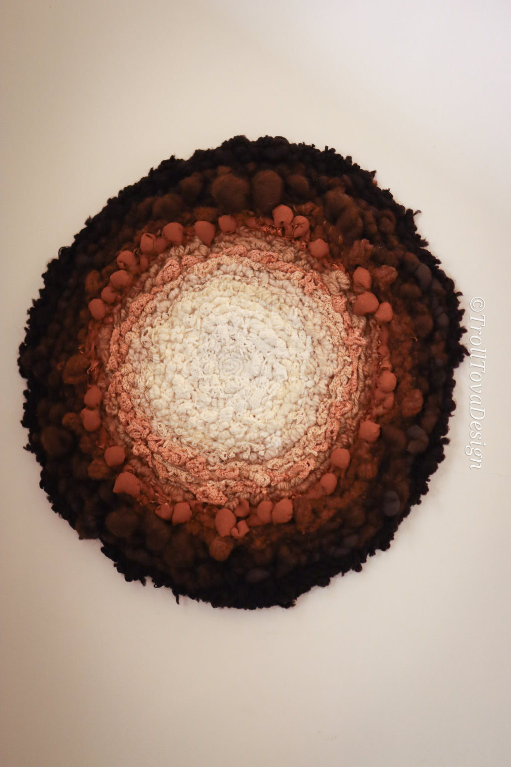 One of a kind handmade textile wall art in white, brown and black.