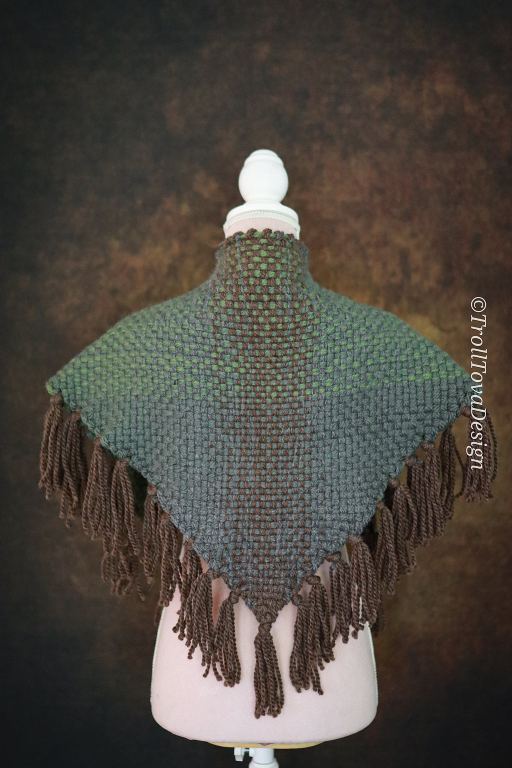 Handwoven triangle shawl made from yarn scraps.