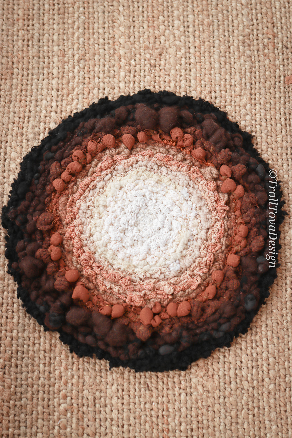 One of a kind handmade textile wall art in white, brown and black.