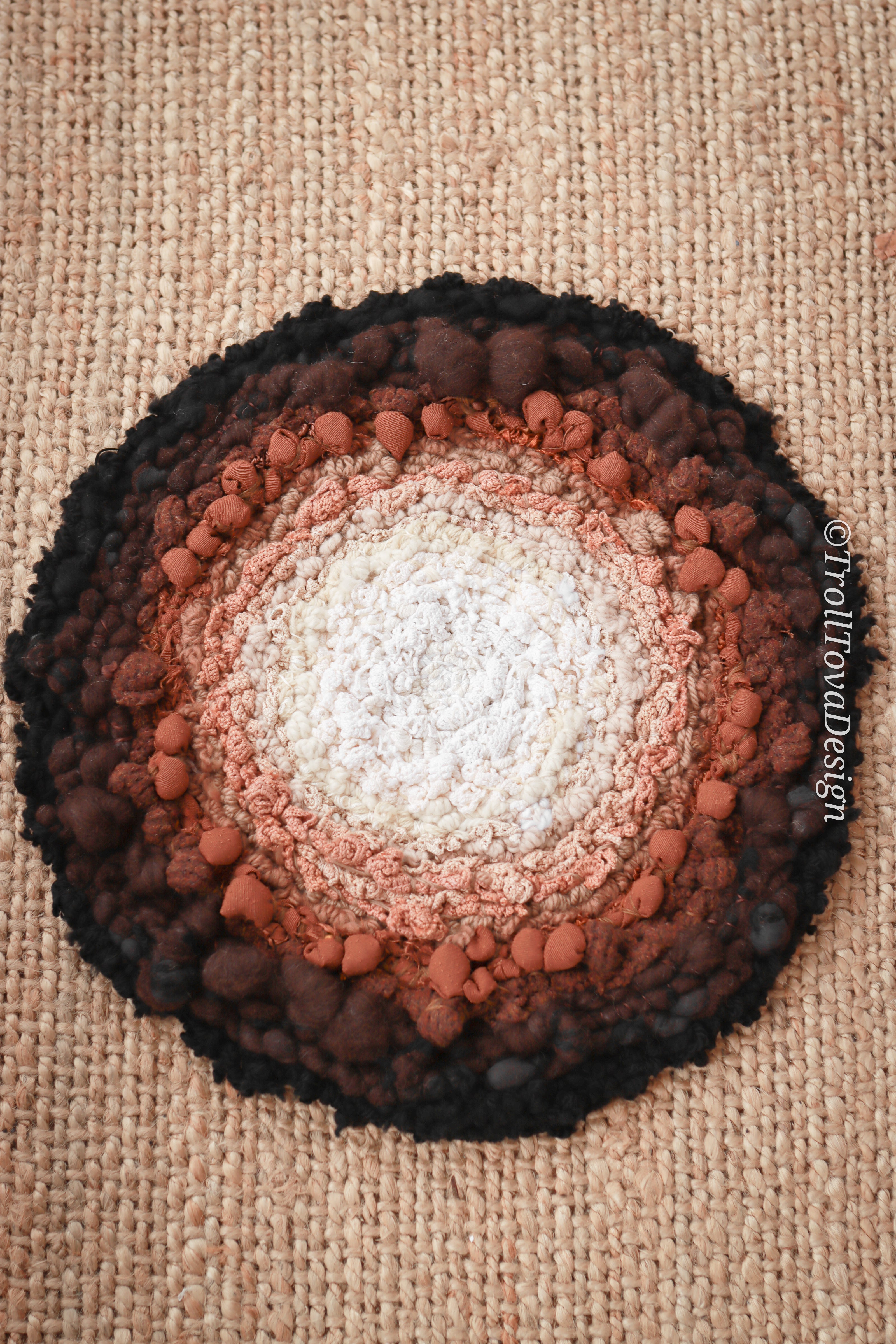 One of a kind handmade textile wall art in white, brown and black.