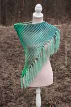 Handwoven triangle shawl made from yarn scraps.