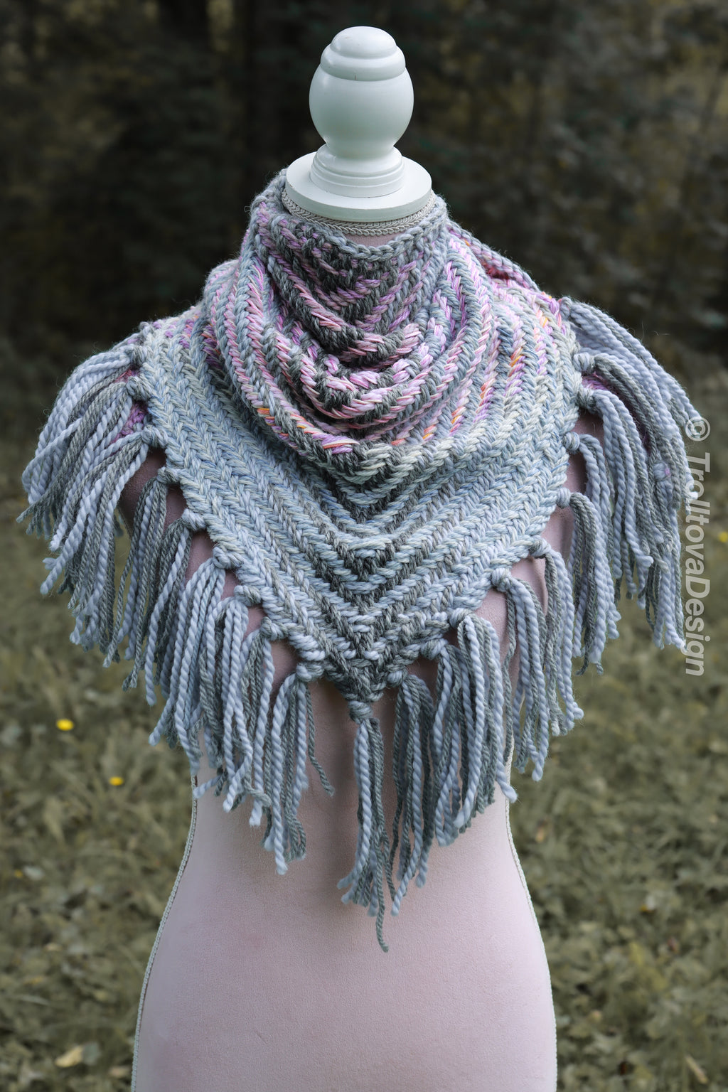 Handwoven triangle shawl made from yarn scraps.