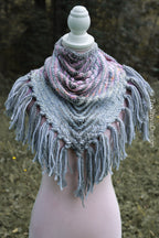 Handwoven triangle shawl made from yarn scraps.