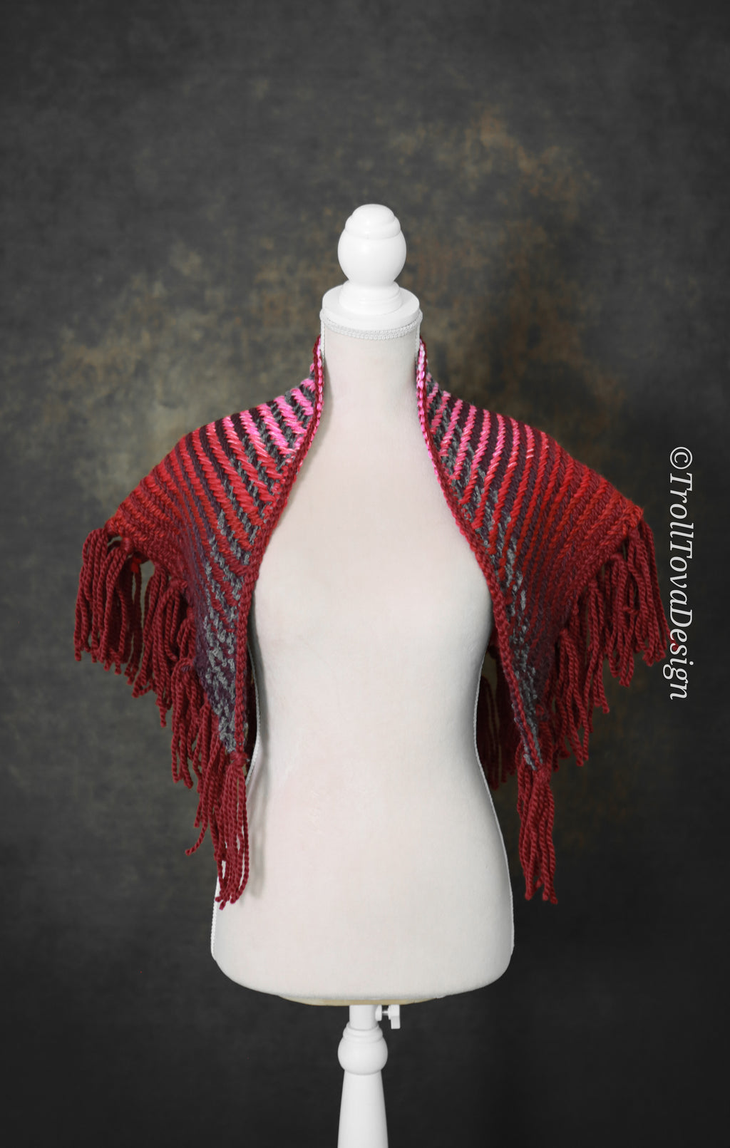 Handwoven triangle shawl made from yarn scraps.