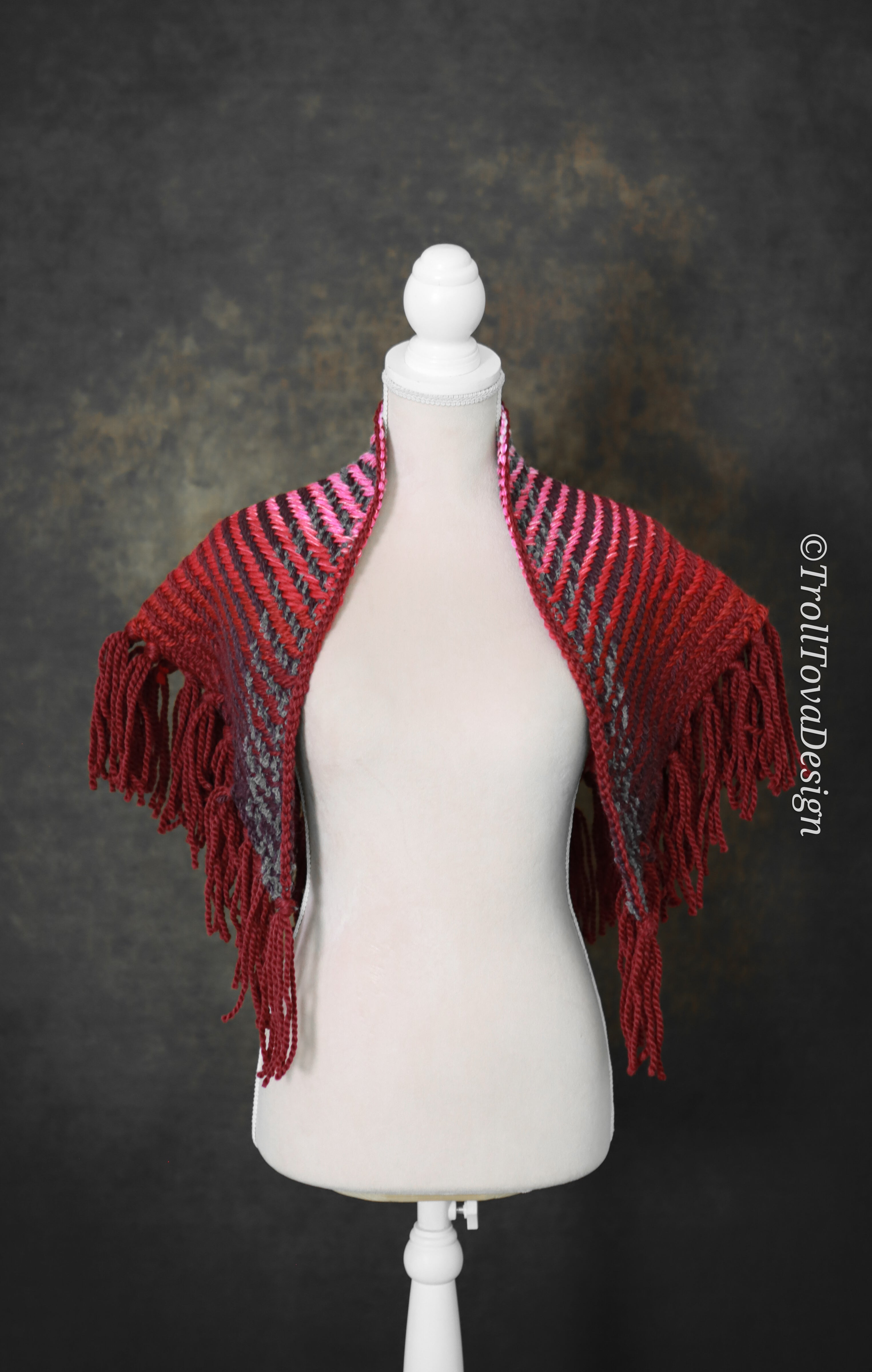 Handwoven triangle shawl made from yarn scraps.