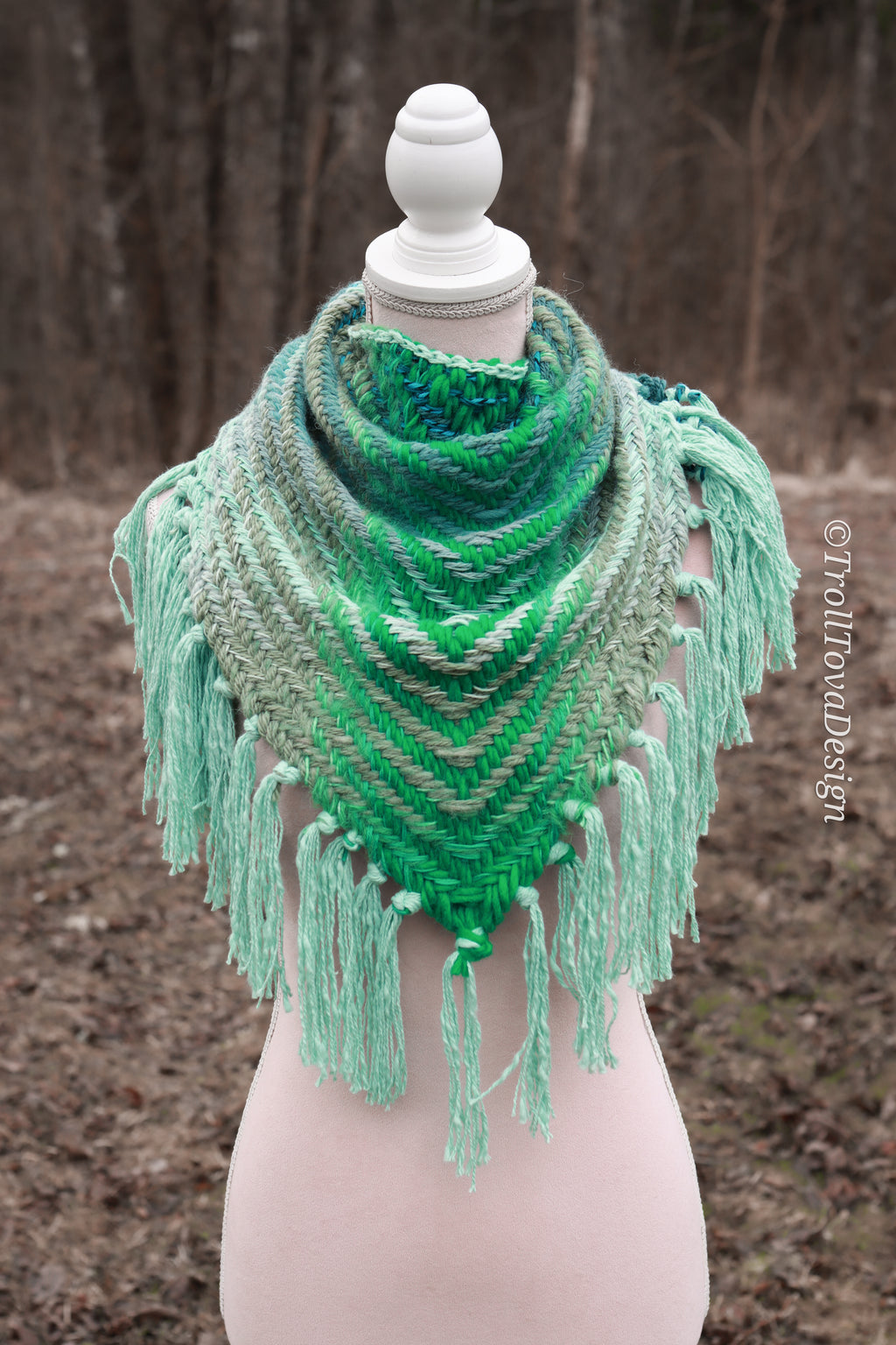 Handwoven triangle shawl made from yarn scraps.