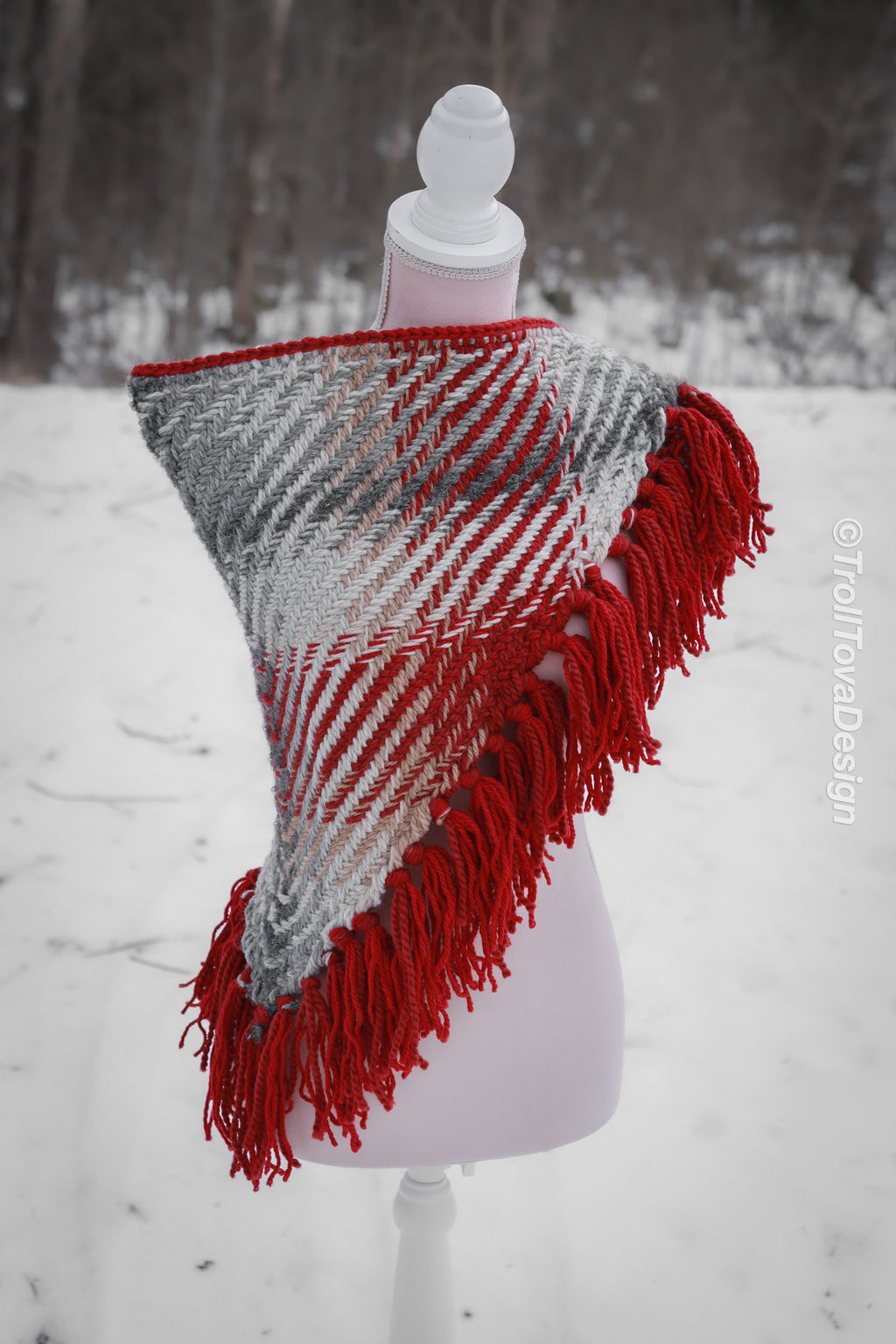 Handwoven triangle shawl made from yarn scraps.