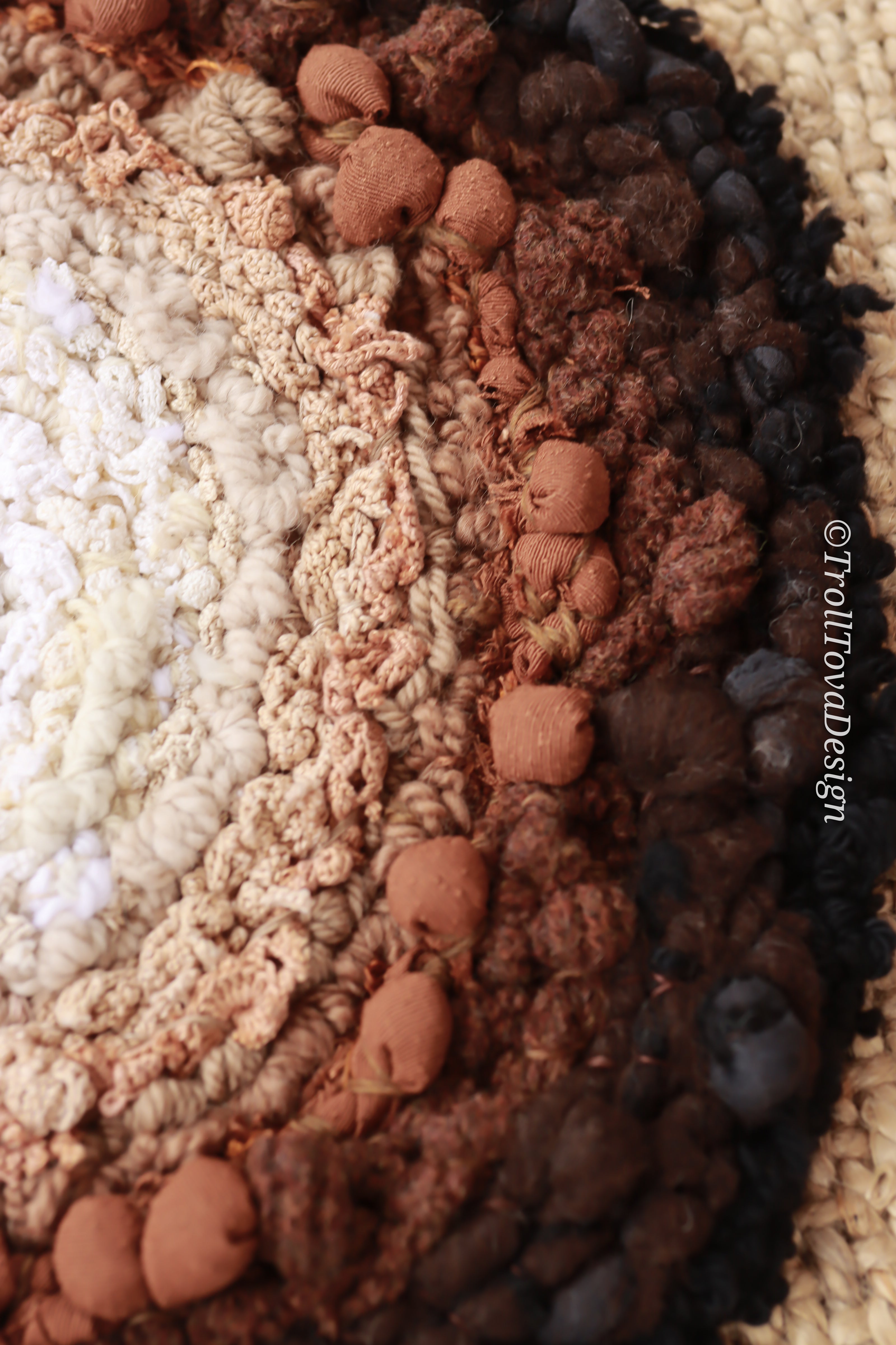 One of a kind handmade textile wall art in white, brown and black.