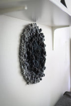 One of a kind handmade textile wall art in gray and black.
