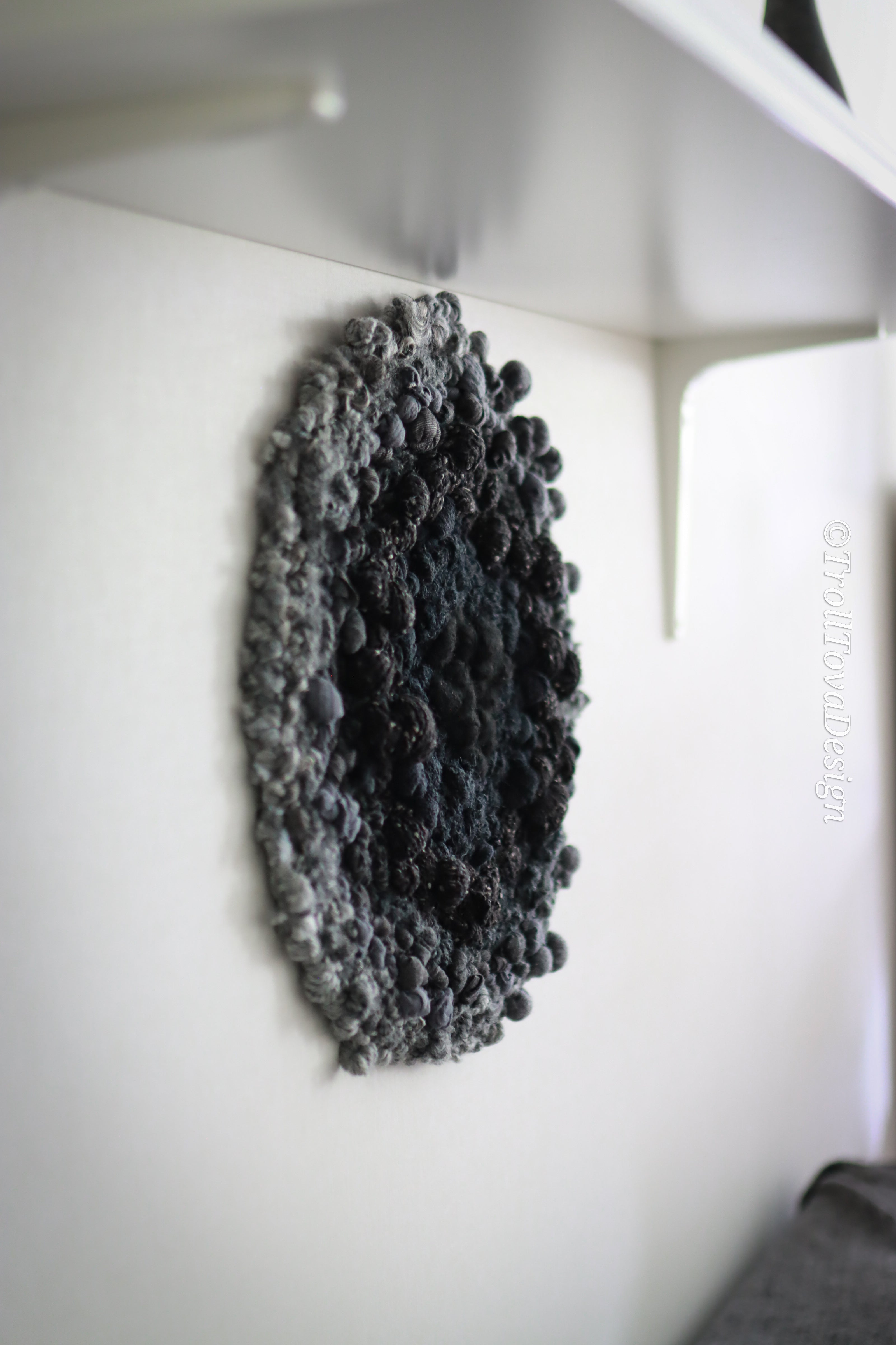 One of a kind handmade textile wall art in gray and black.