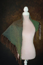 Handwoven triangle shawl made from yarn scraps.