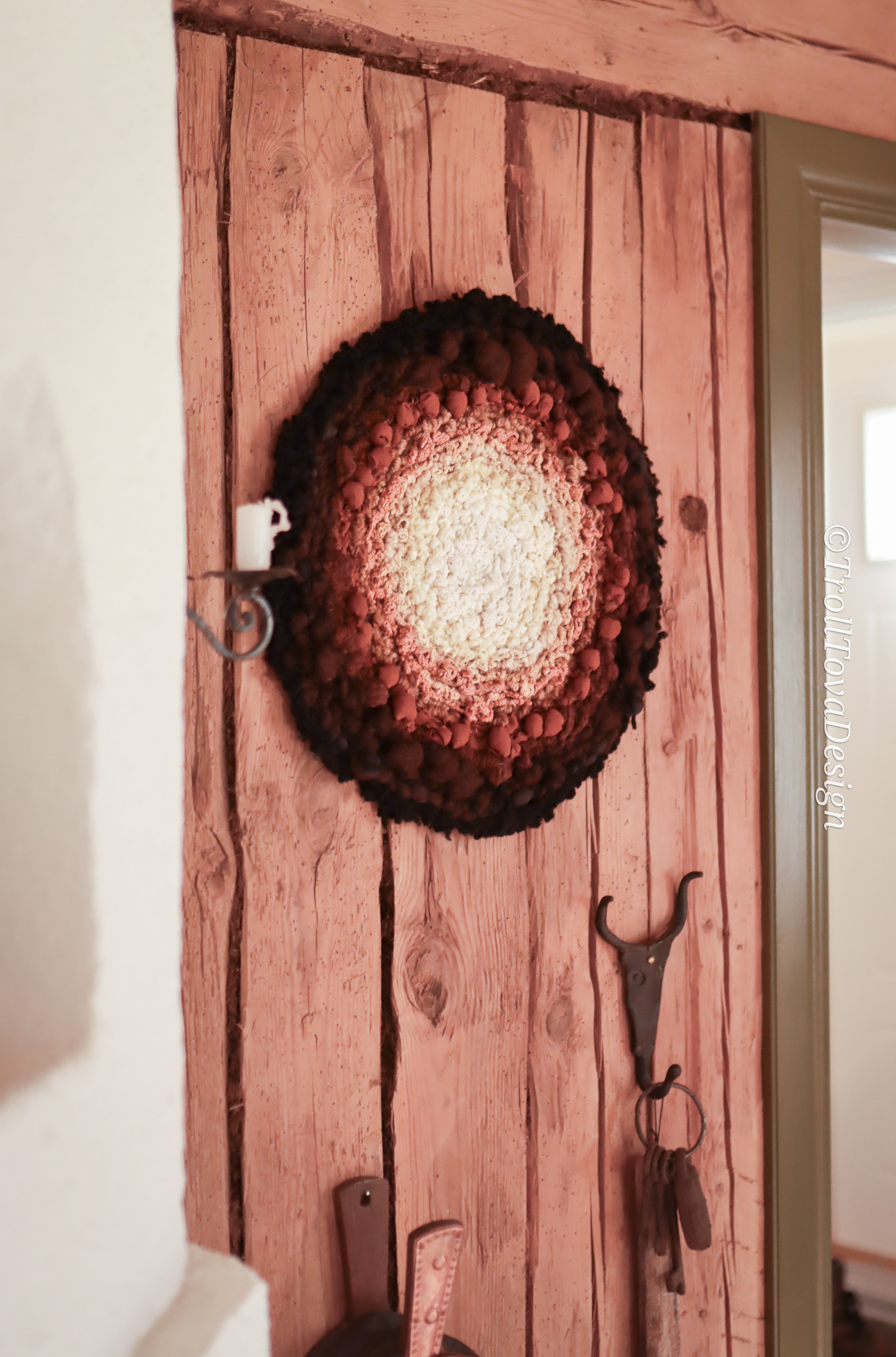 One of a kind handmade textile wall art in white, brown and black.