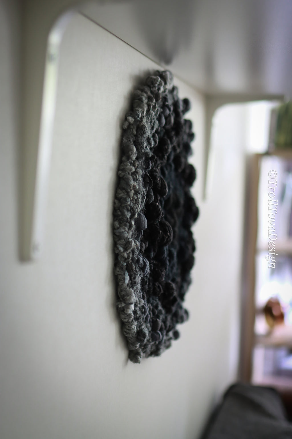 One of a kind handmade textile wall art in gray and black.