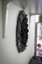 One of a kind handmade textile wall art in gray and black.