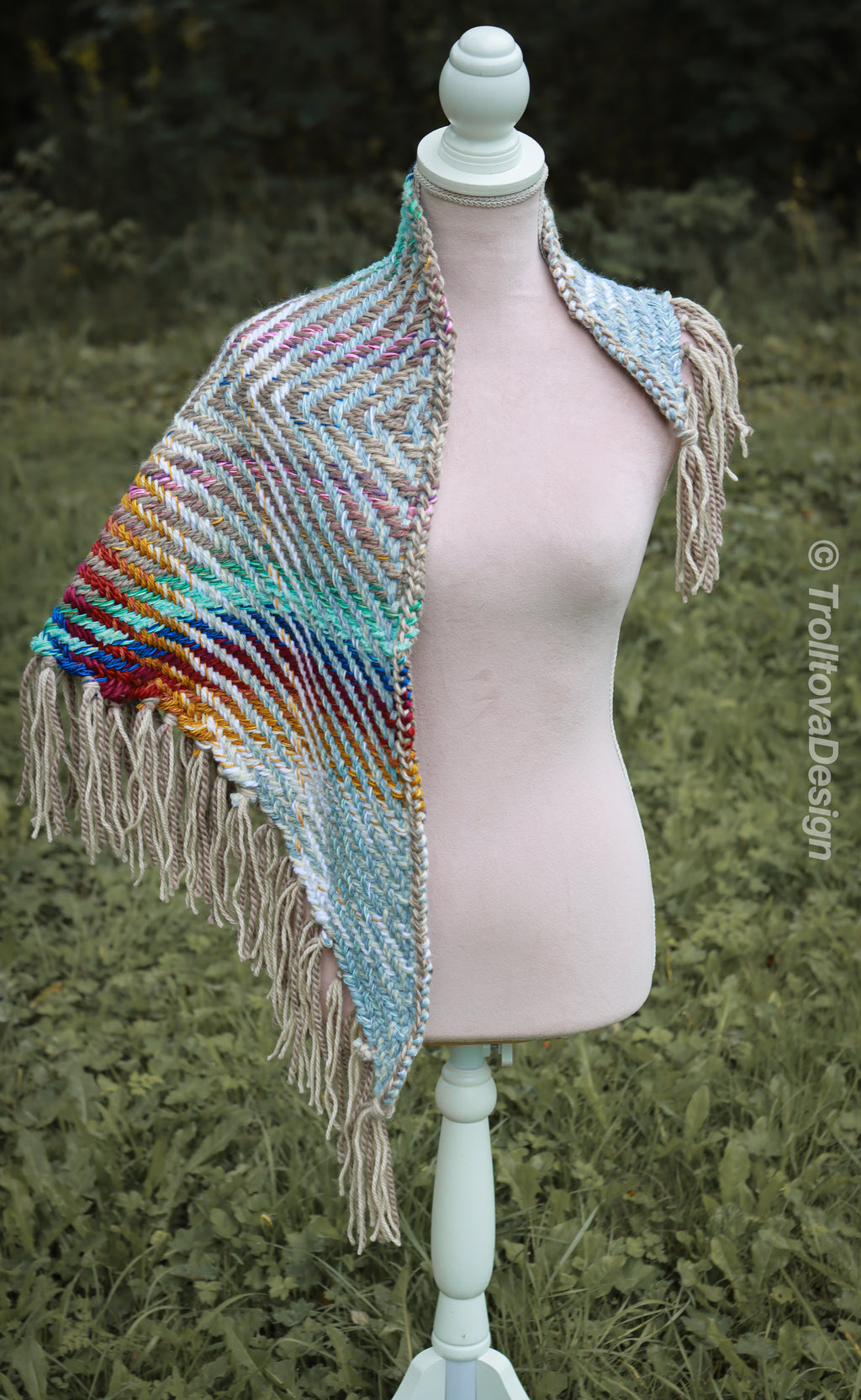 Handwoven triangle shawl made from yarn scraps.